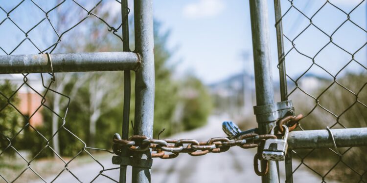 cyclone fence in shallow photography