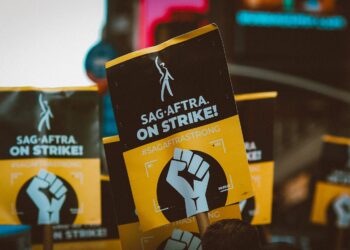 a group of people holding up protest signs