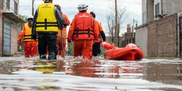 Rescue team in action during flooding in Buenos Aires, aiding relief efforts in affected neighborhoods.